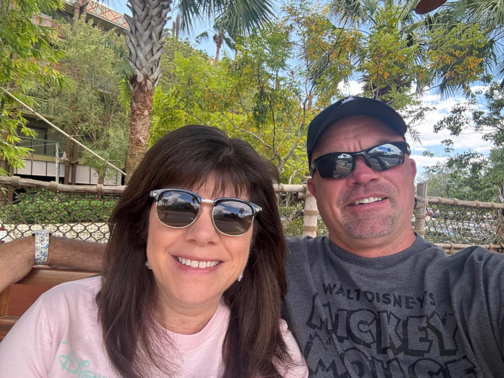 Parents relaxing together during a less stressful Disney World vacation.